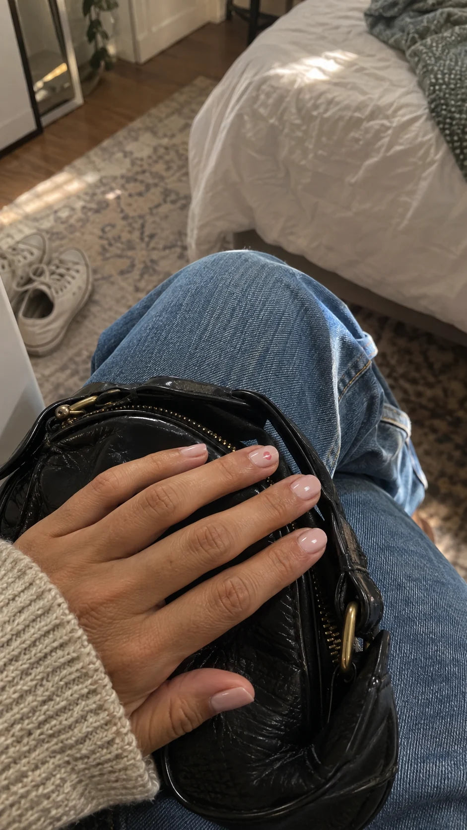 A natural close-up of a manicure while getting ready, from the Lilac Signal brand journal