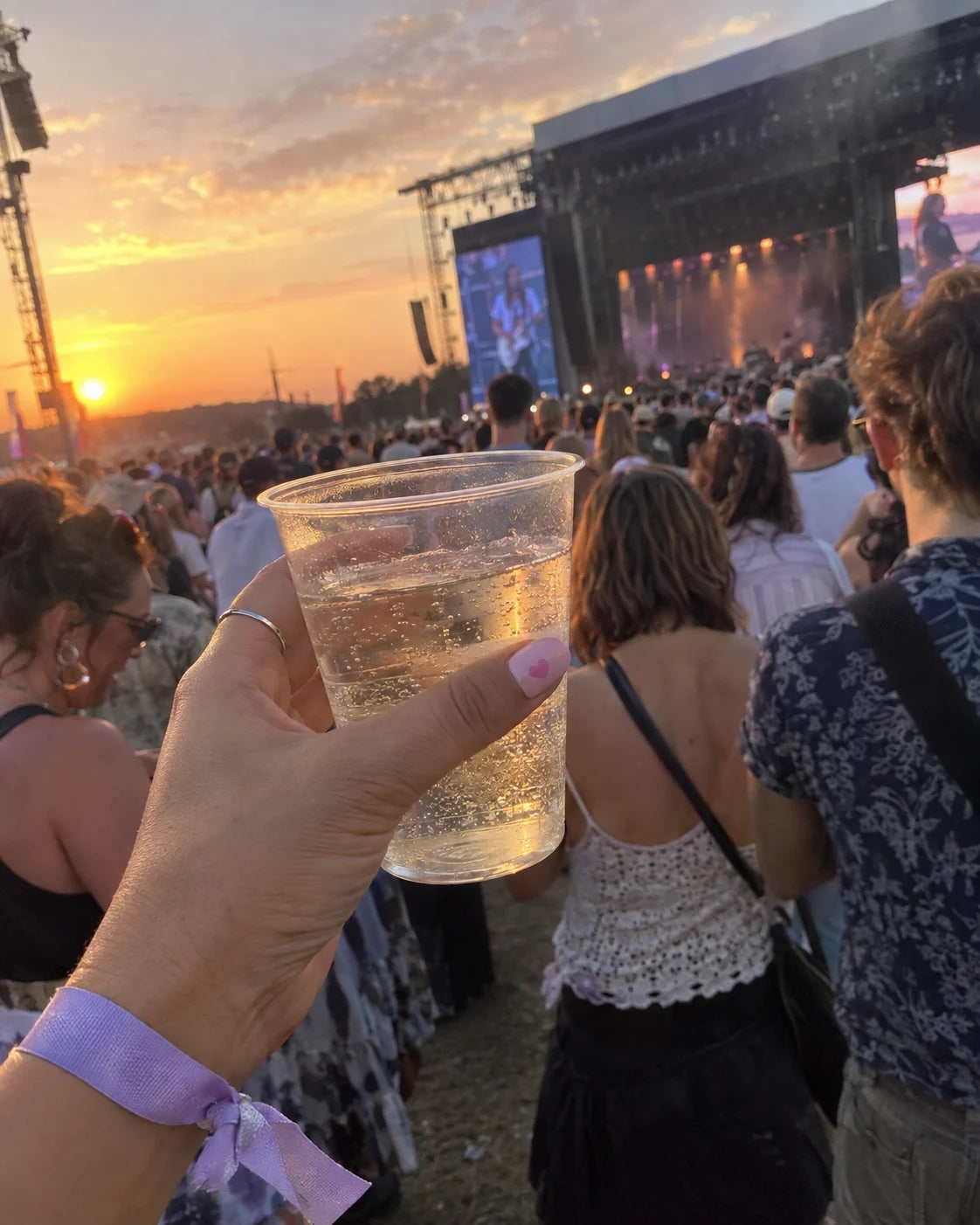 Friends at an outdoor music event, from the Lilac Signal night-out edit